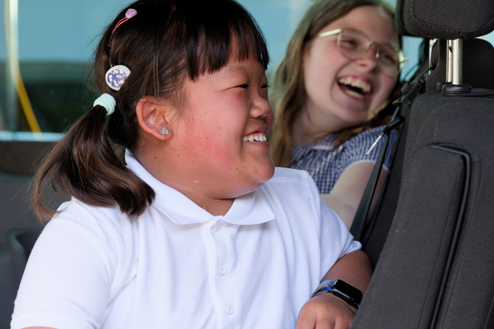 Two students laughing.